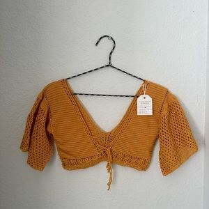 Orange crochet knit top